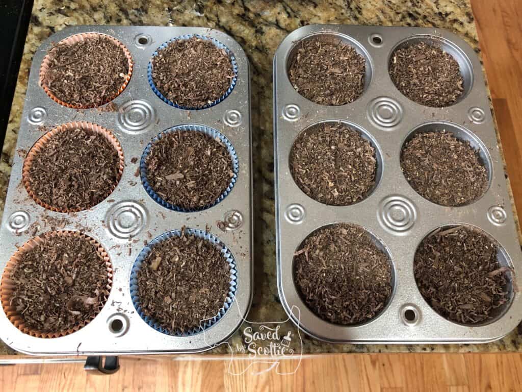 two muffin tins filled with wood shavings one with paper cupcake liners and wood shavings and the other with only wood shavings