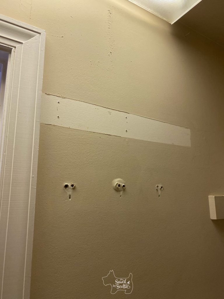 wall with pop outs from removed hooks